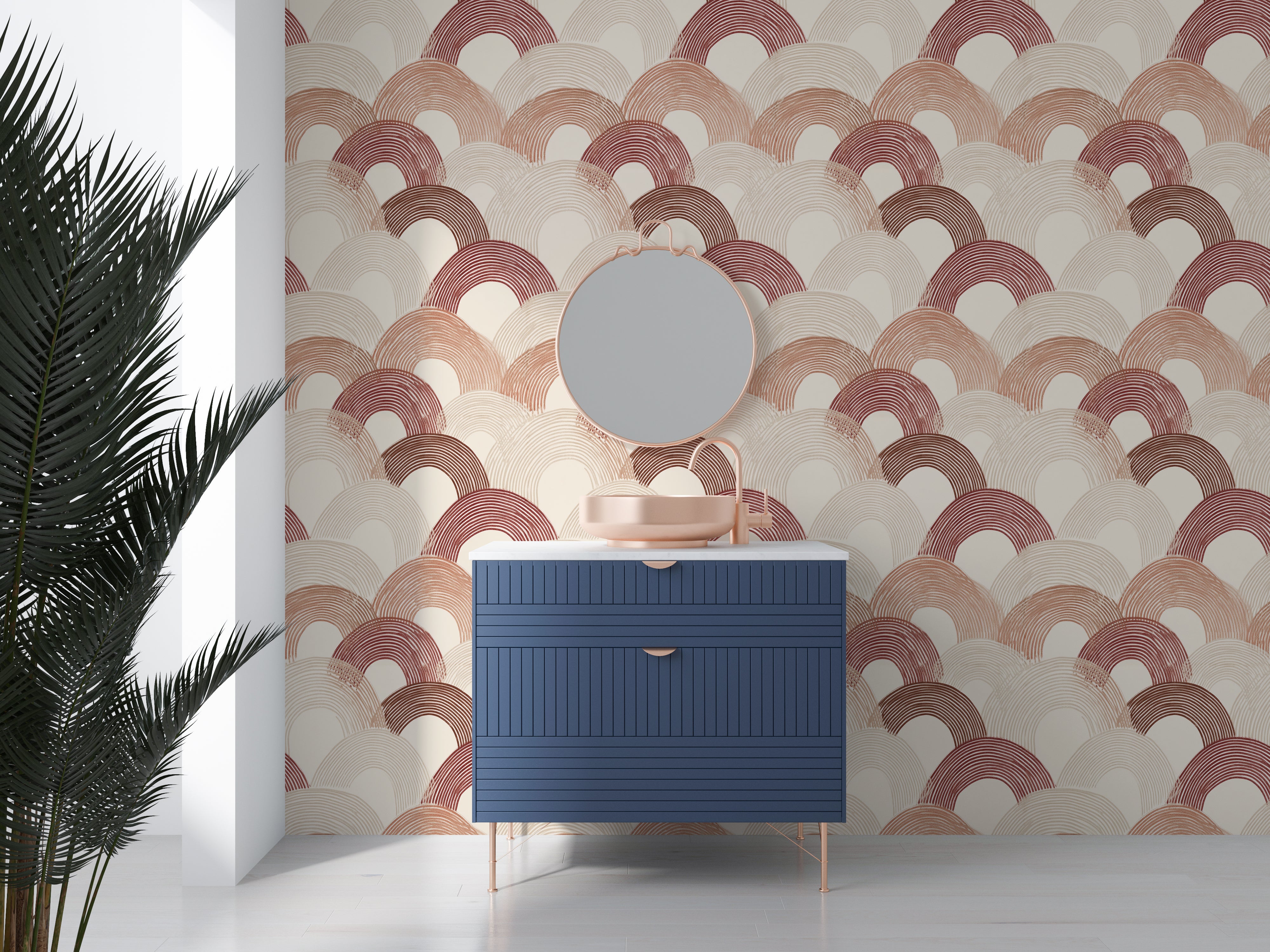 Blue dresser with round mirror against a patterned wall