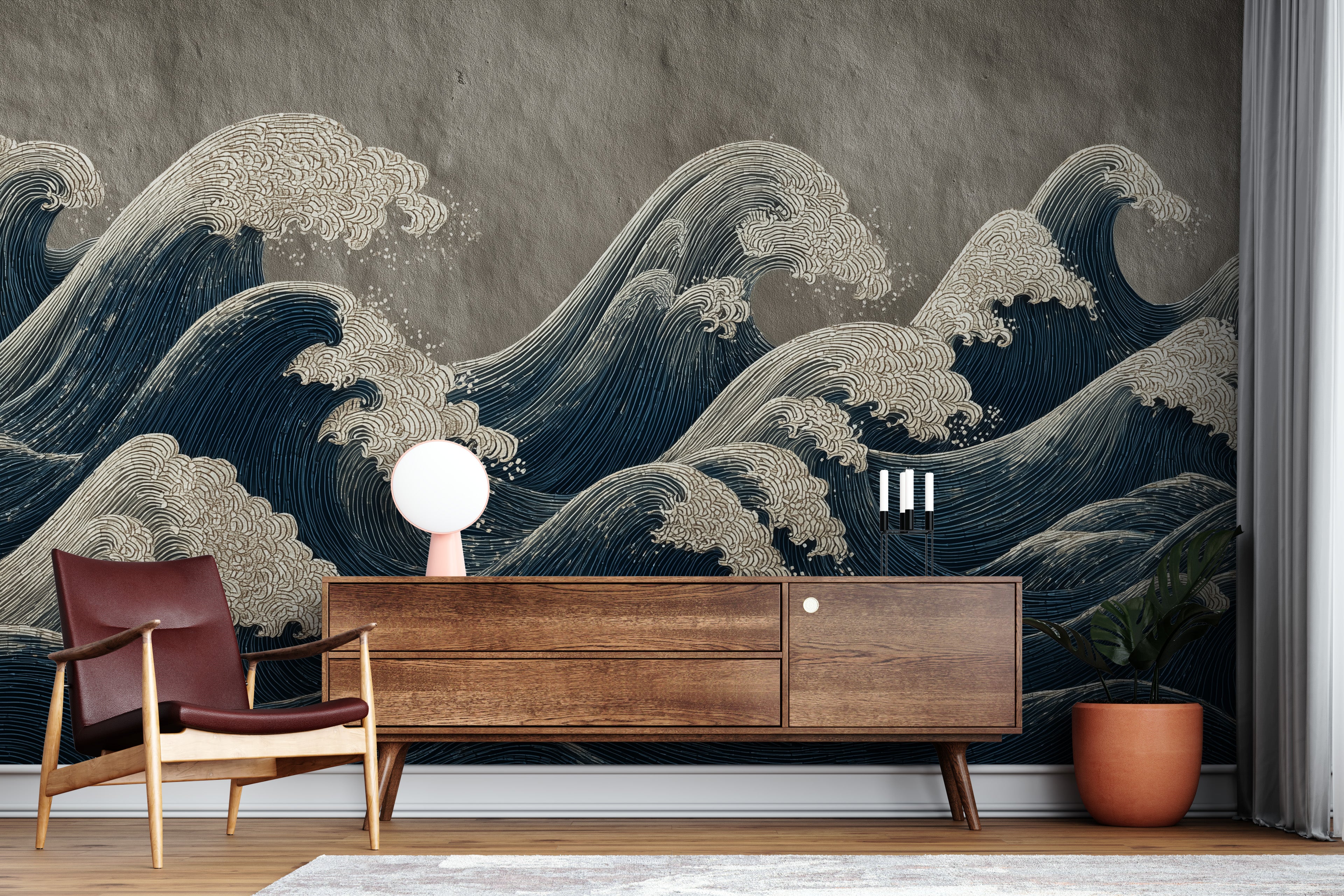 Japanese ocean waves mural in navy blue and cream on wall behind mid-century wood sideboard and chair