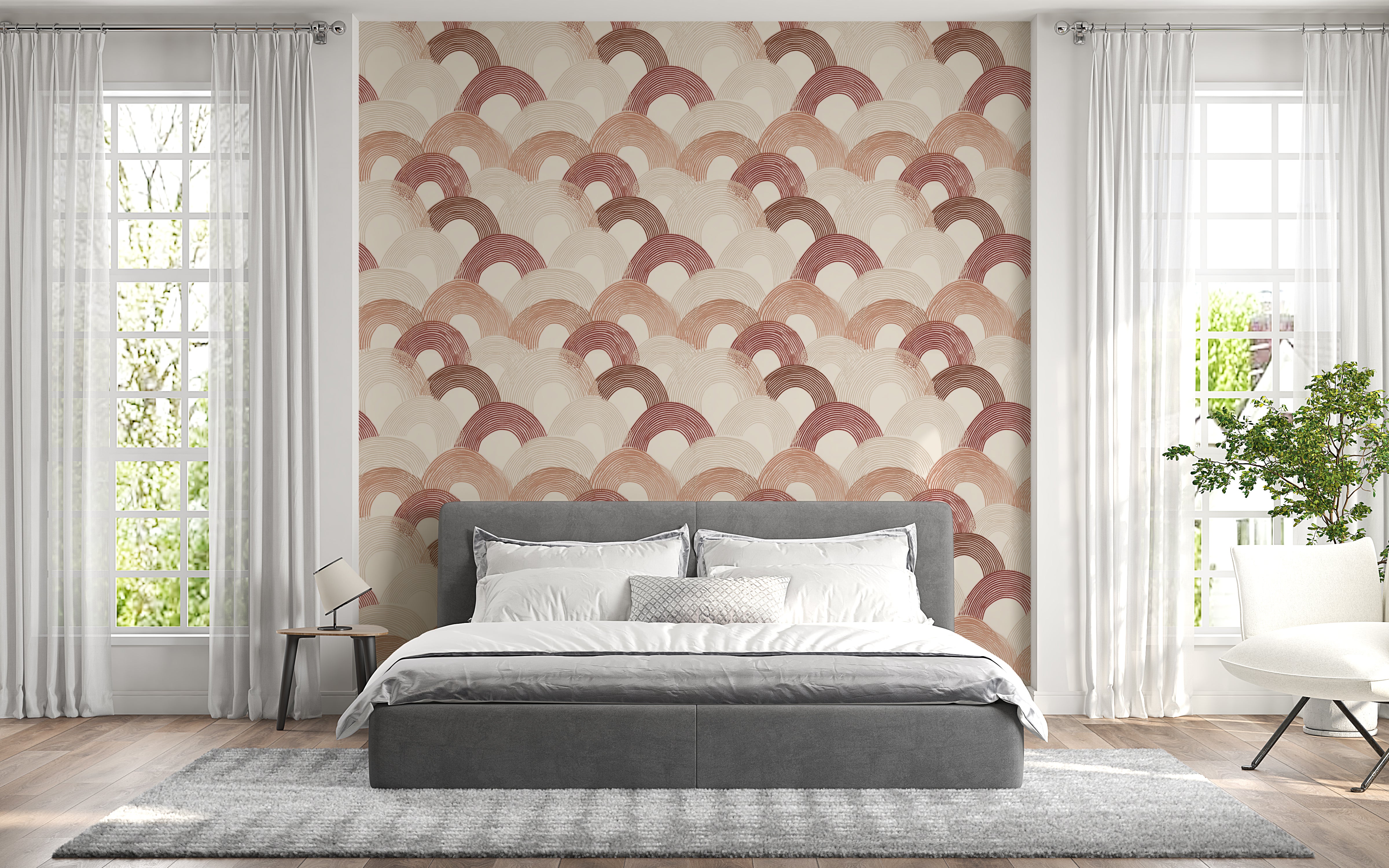 Bedroom with geometric patterned wall paper, bed, and windows.