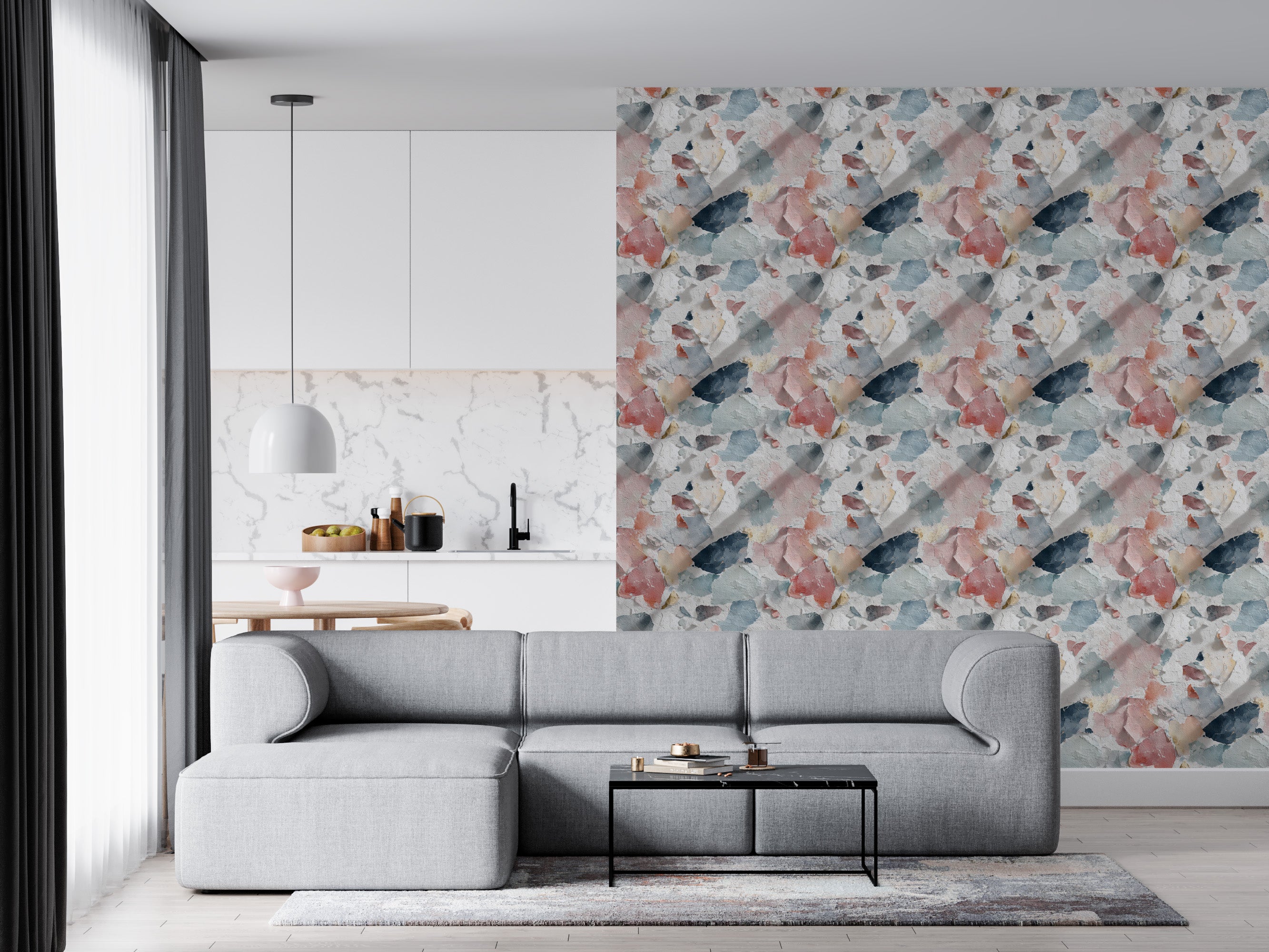 Distressed paint wallpaper in coral blue cream navy multicolor pattern on an accent wall beside a modern gray sofa