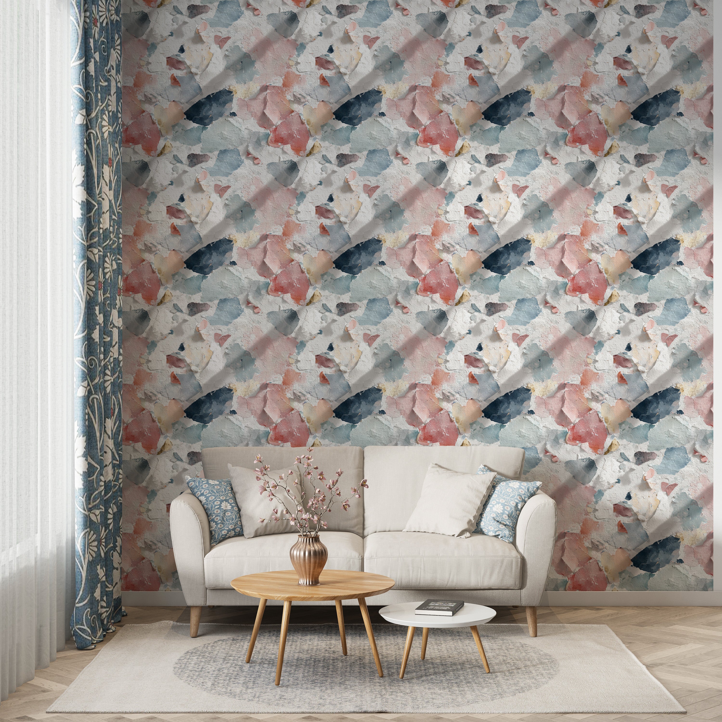 Distressed paint wallpaper in coral blue cream navy with vintage peel and stick texture adorning a cozy living room wall