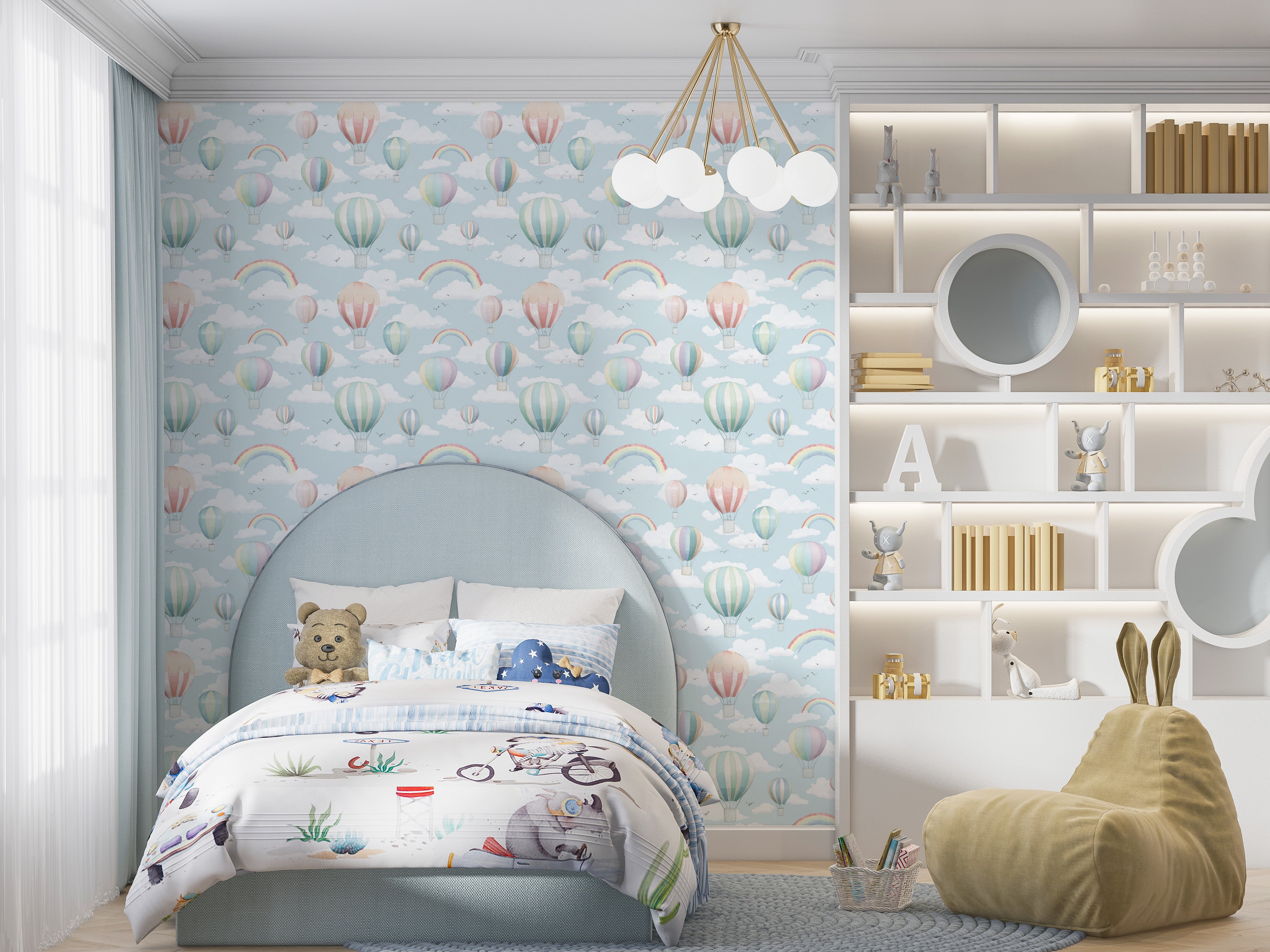 Whimsical hot air balloon wallpaper in a pastel blue nursery with clouds rainbows and a cozy bed setup for kids room palette