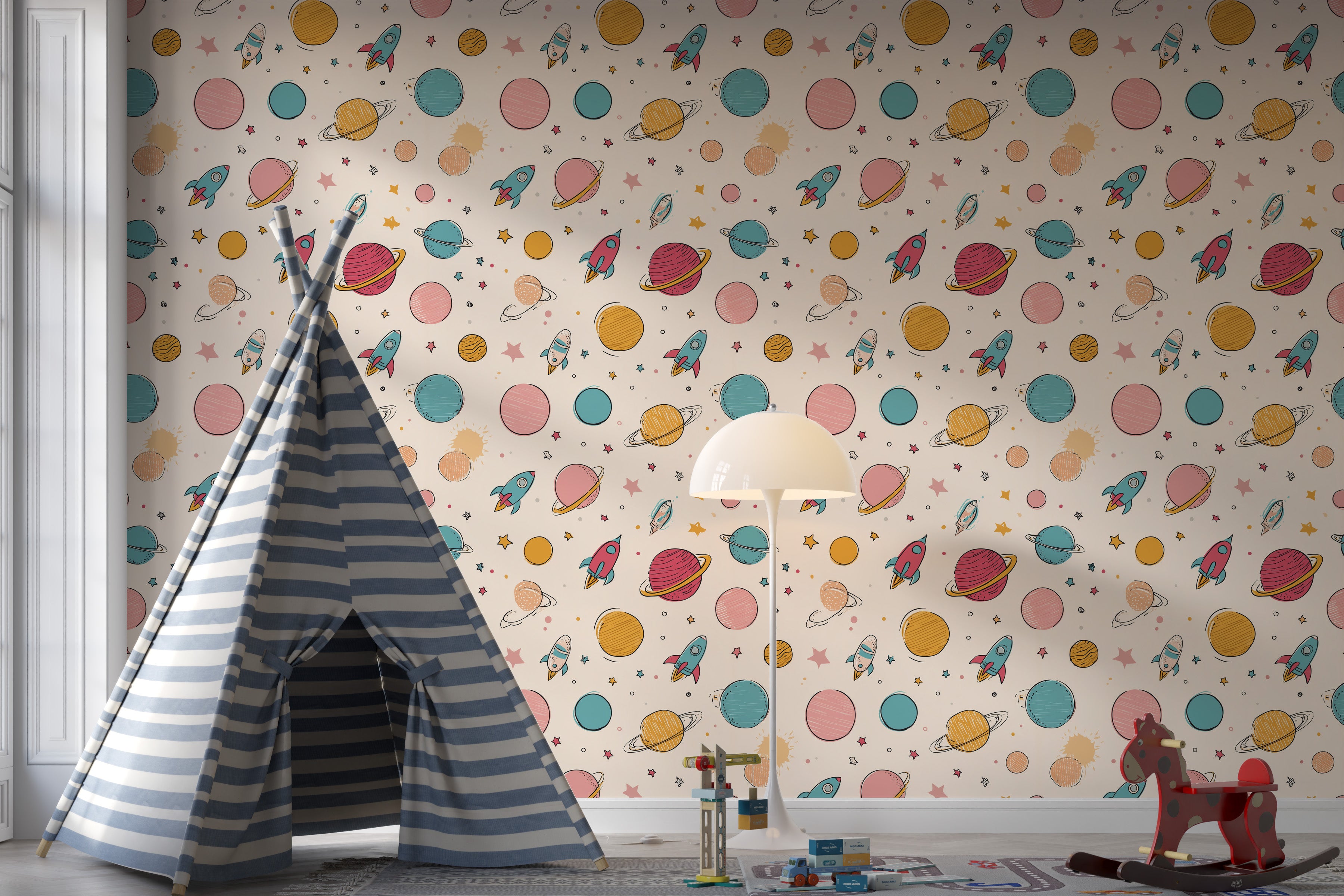 Pastel space wallpaper with planets rockets and stars in a kids room showing a striped blue tent, toy blocks, lamp and playfu